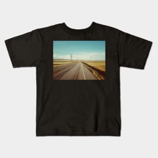 Canadian prairie landscape with a country road near Pincher Creek, Alberta, Canada. Kids T-Shirt